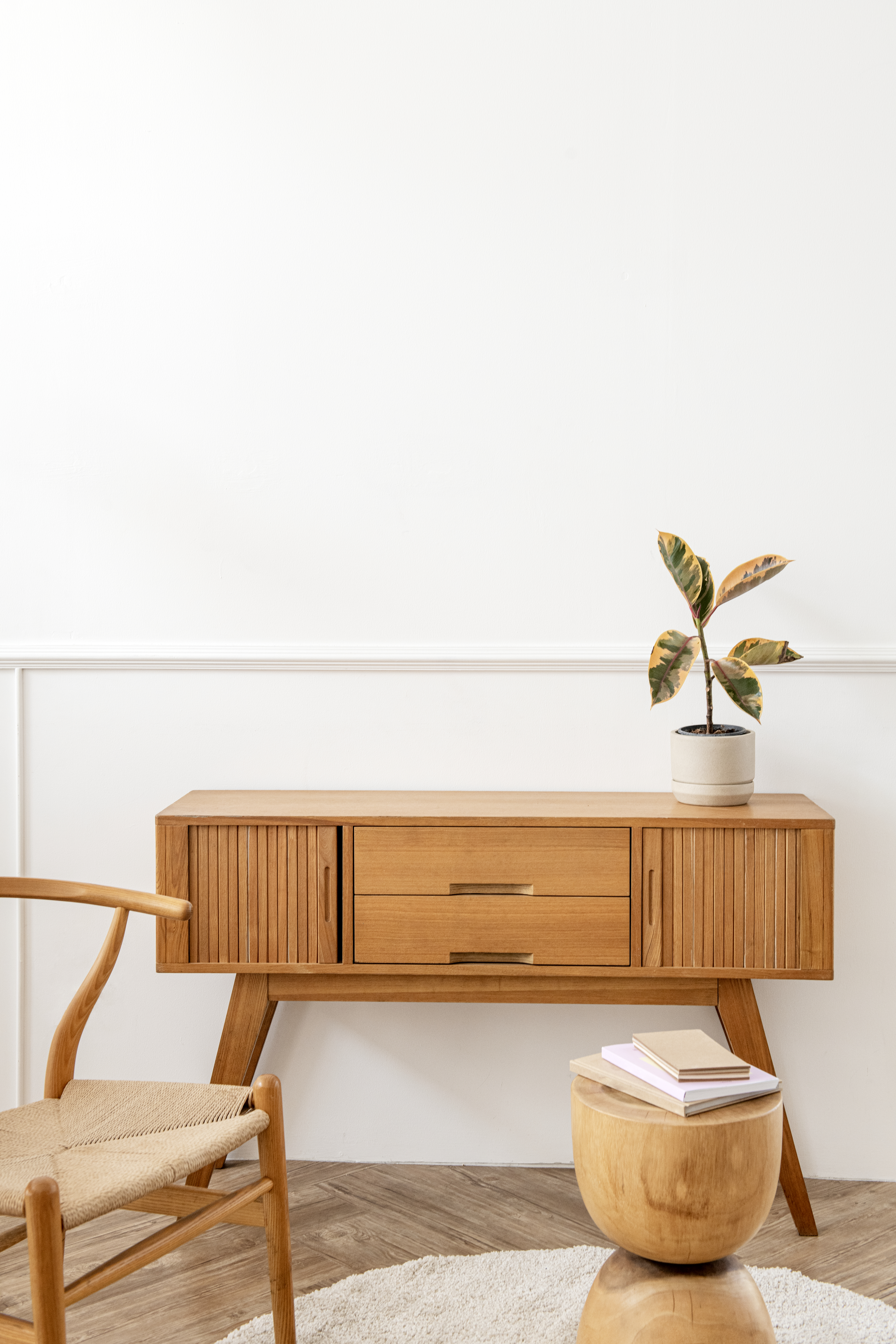 Rubber plant on a wooden sideboard table